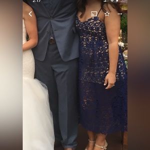 Blue lace midi dress with skin tone lining that stops short.